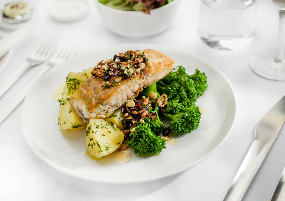 Seared-Cone-Bay-barramundi-with-herbed-garlic-potatoes,-broccolini,-lemo,-olive-and-almond-sala—Business-menu-ex-AUS