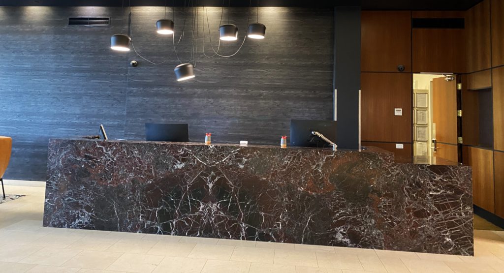 Levanto Italian-marble reception desk at Adina Apartments on Flinders, Melbourne.